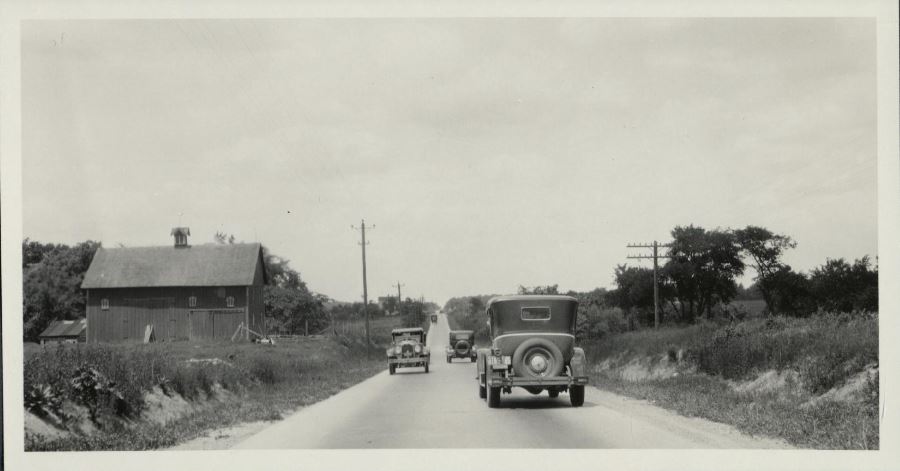 1926 Packard passing cars and farmhouses 4 miles west of Fort Wayne, Indiana